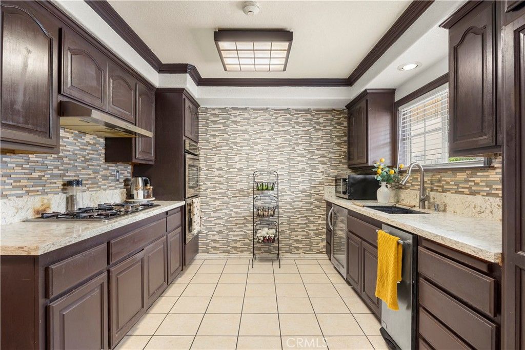 Photo of 9315 Parrot Ave, Downey, CA 90240 (MLS # PW26068671)