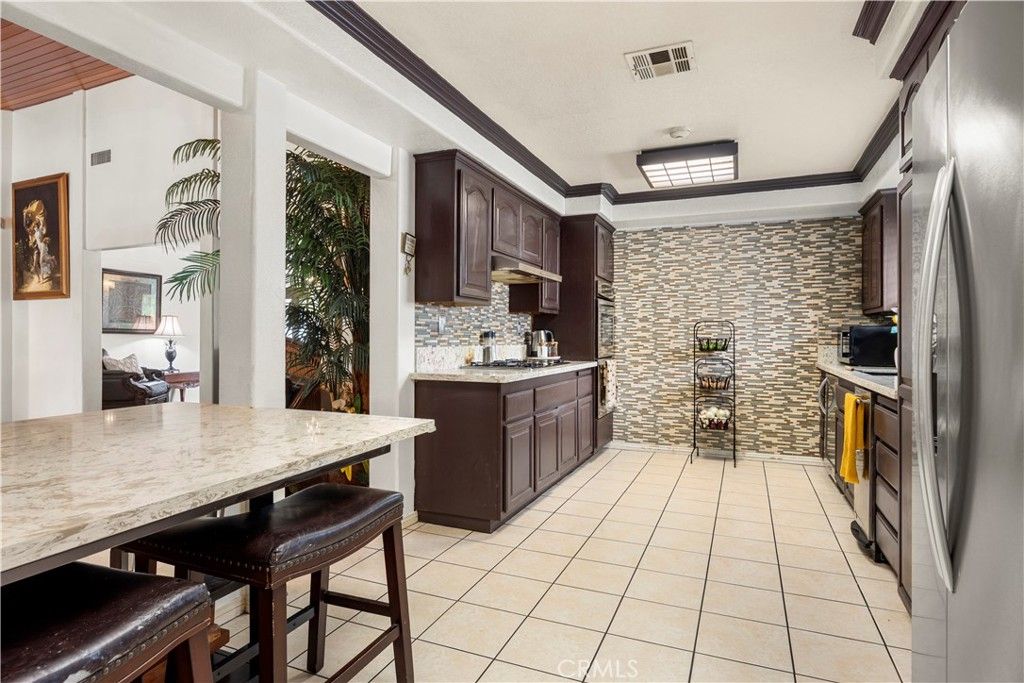 Photo of 9315 Parrot Ave, Downey, CA 90240 (MLS # PW26068671)