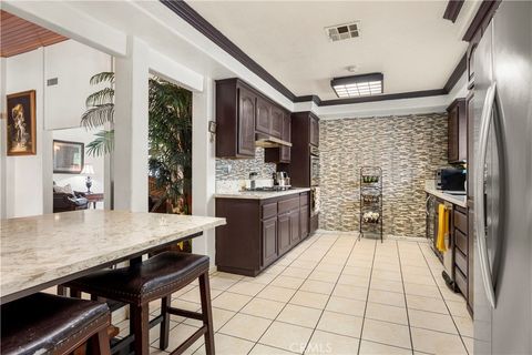 Photo of 9315 Parrot Ave, Downey, CA 90240 (MLS # PW26068671)