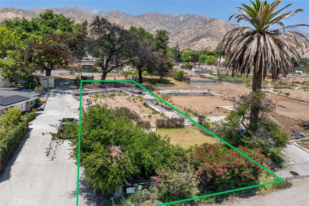 Discover a rare, build-ready parcel in one of Altadena’s most sought-after foothill neighborhoods. Situated at 701 E Palm Street, this expansive 7,600 sq ft vacant lot offers an ideal blank canvas for developers, investors, or end-users looking to capitalize on Southern California’s evolving housing landscape. The property has already undergone Phase 2 environmental clearance with a final certificate of completion, saving you months of time, permitting delays, and demolition costs. With a generally level terrain, existing driveways, and utility access at the street, this lot is truly shovel-ready. Zoned R-1-7500, the site qualifies under California’s SB9 legislation to potentially support two primary dwellings and two ADUs, a tremendous opportunity for rental income, multi-generational living, or resale of two separate units. Whether your vision is luxury duplexes, income-generating ADUs, or a custom estate, the flexibility here is unmatched. Tucked into a peaceful residential enclave with panoramic views of the San Gabriel Mountains, this lot offers not just utility, but beauty. The property boasts lush established landscaping, towering palm trees, and a shared driveway entrance, adding both charm and privacy. Surrounded by newly built and in-progress construction, this block is poised for long-term growth and resale potential. The property is owned free and clear, no loan on title, allowing for a smooth and efficient closing process. 701 E Palm stands out with its combination of location, lot dimensions, and development readiness. Don’t miss this opportunity to build in a blue-chip pocket of Altadena where inventory is scarce and upside is significant.