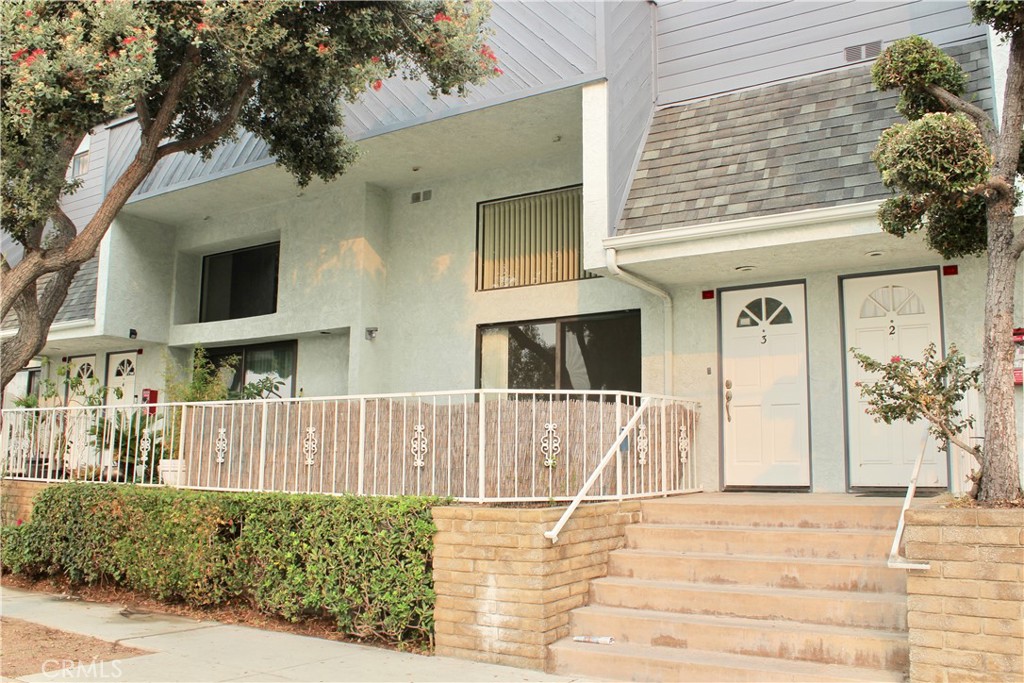 Very nice spacious townhome with bright open floorplan. Big living room with soaring ceiling has fireplace and sliding door to front patio. Middle level has the roomy freshly painted white kitchen with lots of cabinets and tile counter space that opens to the dining and family room areas with a great room feel. Big master suite with balcony, walk-in closet and master bath with skylight. Two more good size bedrooms both open to a balcony, one with high ceiling. New neutral berber carpeting throughout, new flooring in the kitchen and baths, freshly painted throughout. Direct access to a 2-car garage. Laundry hook-up in the unit. Conveniently located within a short distance of schools, shops, services, the beach and more. A truly delightful and comfortable home!