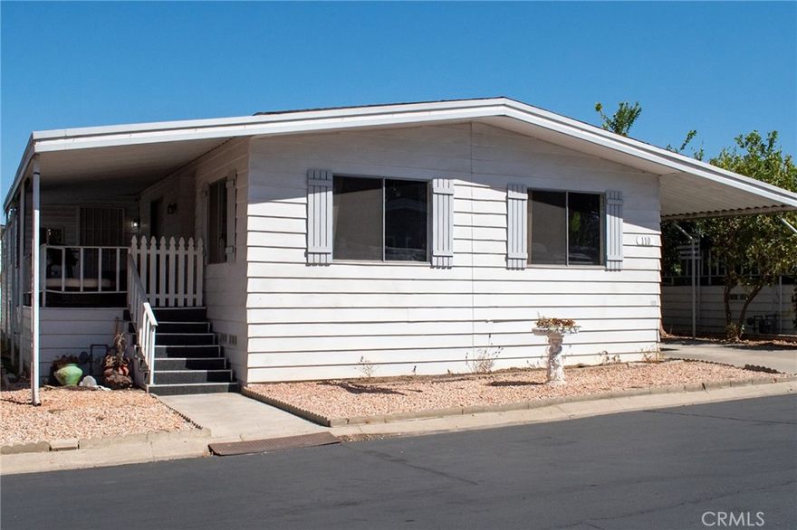 Spacious, budget friendly home located in a family park, all ages welcomed.  This Manufactured home has a  beautifully remodeled kitchen; just a couple years ago the cabinets, counters and appliances were replaced.  You'll love the  stainless steel stove, dishwasher, microwave. Open floorplan, kitchen opens to the family room, where you'll find a matching cabinet used for as a coffee station.  Indiviual Laundry room with newer washer & dryer that are also included.  There are other updates, bathrooms were updated, waterheater is only 3 months old, there is Shed that will remain, Termite tenting was done recently.   The unit is in a great location, just a few steps away from guest parking, pool and a short walk to the clubhouse.  Near the 91 and 15 Fwys.