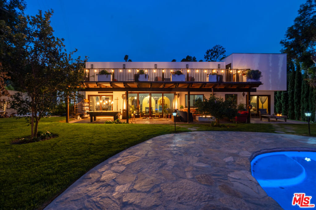 This beautifully renovated Spanish home in Studio City offers 4 bedrooms and 4 bathrooms on 4,000sqft. The home is designed for both comfort, style, and entertainment. High ceilings and large windows bring plenty of natural light, enhancing the open layout connecting living room, dining and kitchen. The gourmet kitchen is equipped with premium appliances and a spacious island. The primary suite features a spa-like bathroom and generous sized walk-in closet. Sliding doors connect house to a serene backyard - an entertainer's dream with a pool, covered patio, and cabanas. Ideally located near top shops, restaurants, and entertainment, this home seamlessly blends Spanish architecture charm with modern luxury.
