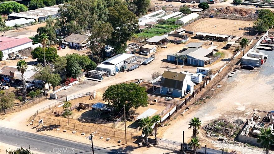 ***AMAIZING OPPORTUNITY TO OWN THIS BEAUTIFUL EQUESTRIAN PROPERTY *** This gem boasts 1.91 acres of flat, usable land. It features a seven-horse barn with covered space for tack and storage ,  11 additional stalls out back, plus 3 larger stalls at the front of the property for a total of 21 stalls, arena, round pen, turnouts, horse walker and wash area. The property is fully fenced and features an automatic gate with a combination lock for added access and safety. It is also well-equipped with plenty of parking space for RVs, trucks, trailers, haulers and for all your toys. The main residence is a comfortable 936 sq. ft., and it offers a living room, plus two bedrooms and one bath downstairs and family room, plus kitchen and one bath upstairs. Additional living space include a modest detached studio with a kitchenet. The interior of this home has been painted with beautiful neutral colors, and it offers many upgrades including ceiling fans throughout, gorgeous kitchen and bathroom cabinets, stylish laminate wood flooring upstairs and in the bedrooms, plus tile downstairs. This unique ranch offers outstanding equestrian facilities, comfortable living, privacy, and potential for expansion all in one package, and to top it off, it is conveniently located just minutes from schools, shopping, SiverLakes Equestrian and Sports park, Interstate 15, and 60 freeway. Call us today for more details!