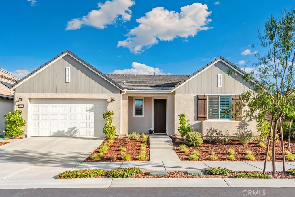 Exquisite luxury living awaits at 32235 Sonder Way in the premier 55+ community of Esplanade at Sommers Bend. PAID in FULL SOLAR. This beautifully upgraded Plan 5 single story home features 3 bedrooms, 2.5 bathrooms, and a thoughtfully designed open layout that blends comfort and sophistication. Inside, you’ll find luxury vinyl plank and tile flooring throughout, along with a gourmet kitchen featuring quartz countertops, a designer backsplash, bronze hardware, a walk-in pantry, and abundant storage, all opening to the dining and gathering areas filled with natural light. The primary suite offers a spa inspired super shower, custom cabinetry with sink, and a spacious walk-in closet, while additional upgrades include mirrored wardrobe doors, enhanced lighting, and pre-wiring for ceiling fans.
The expansive backyard is fully landscaped with artificial turf, custom pavers, and lush greenery, providing a tranquil and private setting ideal for relaxing evenings or entertaining. The home is further enhanced with plantation shutters, custom drapes, rain gutters, epoxy garage flooring with cabinetry, and a modern electric fireplace that adds warmth and style year round.
The Sommers Bend Resort Campus amenities are second to none. Community amenities begin with the impressive clubhouse, featuring a reception area, billiards room, gym, and two indoor gathering spaces, including one with a kitchen. Outdoors, residents enjoy a large swimming pool, relaxing hot tub, pickleball courts, bocce courts, table tennis, a covered patio lounge, firepit, BBQ area, and a garden space. The neighborhood also offers a state of the art wellness center and scenic walking trails. All of this is just minutes from Temecula’s world renowned wineries, award winning restaurants, Pechanga Resort and Casino, and shopping. Sommers Bend offers more than just a home—it offers a lifestyle.