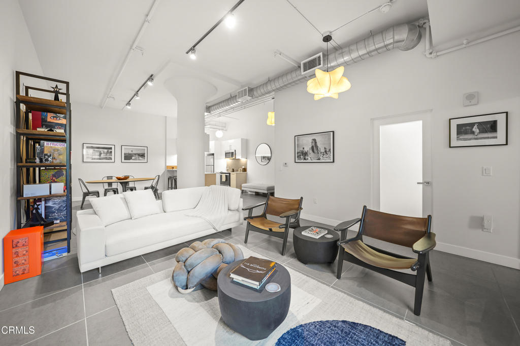 Welcome to Unit 714 at 939 S Broadway, where contemporary living meets historic charm in the heart of Downtown LosAngeles. This spacious 1-bedroom, 1-bathroom loft spans 990 square feet and offers an open-concept design withpolished concrete flooring, high ceilings, and oversized industrial windows that flood the space with natural light. Thedesigner kitchen features sleek stone countertops, European-style cabinetry, and high-end stainless steel appliances,creating the perfect balance of style and function.With only one shared wall, the bedroom area provides a private retreat, while the spa-inspired bathroom includes a deepsoaking tub and modern finishes. Convenience is key, with an elevator located near the unit for easy access. ExperienceDTLA's vibrant lifestyle right at your doorstep, with The United Theater just downstairs and top shopping destinations likethe Apple Store, Urban Outfitters, Whole Foods, West Elm, and Ganni Clothing Boutique all conveniently nearby. Enjoy theneighborhood charm with coffee shops like ilcaffe and Verve Coffee Roasters, or explore the weekend farmers markets thatbring a lively community atmosphere to the heart of downtown.The building offers world-class amenities, including a rooftop pool, spa, lounge areas, and a BBQ area, all designed tomaximize comfort while enjoying panoramic city views. HOA dues include access to these luxurious features, along with thebest perk of all--views, views, views.Experience the best of Downtown Los Angeles with this stunning loft. Schedule a private tour today!