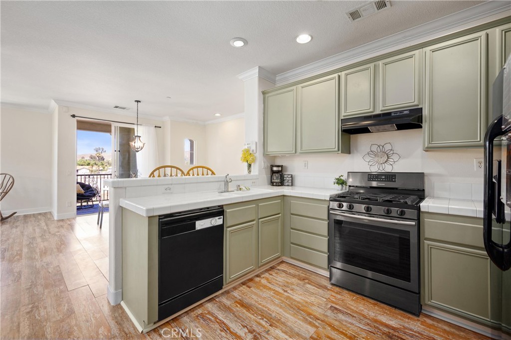 2-CAR ATTACHED GARAGE | PANORAMIC MOUNTAIN VIEWS | UPGRADED | END UNIT | MOVE-IN READY | OPEN CONCEPT | Welcome to this beautiful condo in the desirable Belcaro Lake Point community, where comfort, style, and convenience come together. Step inside and be greeted by abundant natural light and panoramic views that create a warm and inviting atmosphere throughout. The living room features a cozy gas fireplace and flows seamlessly into the dining area, ideal for entertaining and everyday living. The kitchen is a chef’s delight with breakfast bar seating, a double sink, pantry, and freshly painted ample cabinetry that gives it a bright, updated look. The spacious primary bedroom offers plenty of room for a seating area and includes a generous walk-in closet. The ensuite bathroom is designed for both function and relaxation, featuring dual sink countertops, abundant storage, a dual showerhead, and a privacy door. A well-sized second bedroom provides flexibility for guests or family, while the second full bathroom includes a tub and shower combination. The bonus room is the perfect space for a private office, gym, or creative studio, adding versatility to the floorplan. For added convenience, the home includes an in-unit laundry room complete with washer and dryer. Step outside to the large covered private patio, the perfect place to relax and take in breathtaking sunsets. UPGRADES: Crown Molding, Wide Floor Molding, Updated Luxury Flooring, LED lights, and fresh paint throughout. AMENITIES: Enjoy a quick walk to resort-style amenities including a sparkling pool and spa with shower facilities, a playground, BBQ, and beautifully maintained grounds. LOCATION: Easy access to Storm Stadium, the Lake, shopping outlets, and scenic biking trails. COMMUTE: Quick access to 15 Expressway, 91 & 71 Freeways, & 241 Toll Road. Close to 15 Frwy, Ortega highway, and nearby public transit. This home combines modern comfort with an unbeatable location, making it a wonderful opportunity for those seeking both tranquility and convenience.