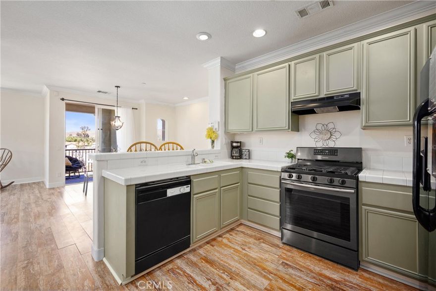 2-CAR ATTACHED GARAGE | PANORAMIC MOUNTAIN VIEWS | UPGRADED | END UNIT | MOVE-IN READY | OPEN CONCEPT | Welcome to this beautiful condo in the desirable Belcaro Lake Point community, where comfort, style, and convenience come together. Step inside and be greeted by abundant natural light and panoramic views that create a warm and inviting atmosphere throughout. The living room features a cozy gas fireplace and flows seamlessly into the dining area, ideal for entertaining and everyday living. The kitchen is a chef’s delight with breakfast bar seating, a double sink, pantry, and freshly painted ample cabinetry that gives it a bright, updated look. The spacious primary bedroom offers plenty of room for a seating area and includes a generous walk-in closet. The ensuite bathroom is designed for both function and relaxation, featuring dual sink countertops, abundant storage, a dual showerhead, and a privacy door. A well-sized second bedroom provides flexibility for guests or family, while the second full bathroom includes a tub and shower combination. The bonus room is the perfect space for a private office, gym, or creative studio, adding versatility to the floorplan. For added convenience, the home includes an in-unit laundry room complete with washer and dryer. Step outside to the large covered private patio, the perfect place to relax and take in breathtaking sunsets. UPGRADES: Crown Molding, Wide Floor Molding, Updated Luxury Flooring, LED lights, and fresh paint throughout. AMENITIES: Enjoy a quick walk to resort-style amenities including a sparkling pool and spa with shower facilities, a playground, BBQ, and beautifully maintained grounds. LOCATION: Easy access to Storm Stadium, the Lake, shopping outlets, and scenic biking trails. COMMUTE: Quick access to 15 Expressway, 91 & 71 Freeways, & 241 Toll Road. Close to 15 Frwy, Ortega highway, and nearby public transit. This home combines modern comfort with an unbeatable location, making it a wonderful opportunity for those seeking both tranquility and convenience.