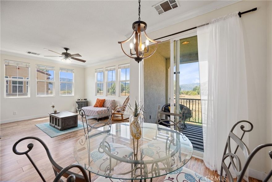 VA-LOAN ELIGIBLE CONDO!! 2-CAR ATTACHED GARAGE | PANORAMIC MOUNTAIN VIEWS | UPGRADED | END UNIT | MOVE-IN READY | OPEN CONCEPT | Welcome to this beautiful condo in the desirable Belcaro Lake Point community, where comfort, style, and convenience come together. Step inside and be greeted by abundant natural light and panoramic views that create a warm and inviting atmosphere throughout. The living room features a cozy gas fireplace and flows seamlessly into the dining area, ideal for entertaining and everyday living. The kitchen is a chef’s delight with breakfast bar seating, a double sink, pantry, and freshly painted ample cabinetry that gives it a bright, updated look. The spacious primary bedroom offers plenty of room for a seating area and includes a generous walk-in closet. The ensuite bathroom is designed for both function and relaxation, featuring dual sink countertops, abundant storage, a dual showerhead, and a privacy door. A well-sized second bedroom provides flexibility for guests or family, while the second full bathroom includes a tub and shower combination. The bonus room is the perfect space for a private office, gym, or creative studio, adding versatility to the floorplan. For added convenience, the home includes an in-unit laundry room complete with washer and dryer. Step outside to the large covered private patio, the perfect place to relax and take in breathtaking sunsets. UPGRADES: Crown Molding, Wide Floor Molding, Updated Luxury Flooring, LED lights, and fresh paint throughout. AMENITIES: Enjoy a quick walk to resort-style amenities including a sparkling pool and spa with shower facilities, a playground, BBQ, and beautifully maintained grounds. LOCATION: Easy access to Storm Stadium, the Lake, shopping outlets, and scenic biking trails. COMMUTE: Quick access to 15 Expressway, 91 & 71 Freeways, & 241 Toll Road. Close to 15 Frwy, Ortega highway, and nearby public transit. This home combines modern comfort with an unbeatable location, making it a wonderful opportunity for those seeking both tranquility and convenience.