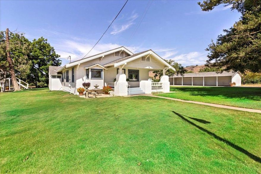 Discover this exceptional 20-acre ranch featuring a producing apple orchard with approximately 5,000 mature trees, offering outstanding agricultural and income opportunities. The centerpiece is a beautifully updated 1920s 4-bedroom, 2-bath farmhouse with fresh paint, new flooring, spacious living and family rooms, and a fantastic kitchen designed for entertaining. Additional residences include a separate 1,100sf  2-bedroom, 2-bath manufactured home in excellent condition currently rented month-to-month for immediate income plus two cabins, each with kitchens and bathrooms, providing even more flexibility for guests, extended family, or rentals. The property also boasts a huge detached shop, a 6-car carport, and the convenience of both a residential well and a separate agricultural well. With multiple legal lots, this rare offering combines country charm with modern updates, abundant resources, and endless income potential.