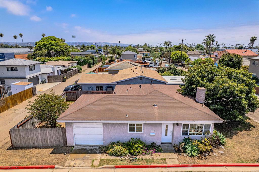 Fall in love with this charming 2-bedroom, 1.5-bath detached home in Imperial Beach. Just ¾ mile from the sand & surf, this open-concept beauty offers comfort, style & unbeatable value in a vibrant beach community. Step inside to find freshly painted interiors, new carpet & baseboards. The spacious living room and both bedrooms feature stylish recessed tray ceilings, adding a touch of elegance thru-out. Cozy up by the gorgeous wood-burning fireplace, complete with a bench seat and classic mantel - perfect for cool coastal evenings or adding ambiance to any evening! The kitchen is a dream with granite countertops, pale blonde shaker cabinets, and plenty of space to cook and gather with counter seating. Enjoy meals in the formal dining room or morning coffee in the sunny breakfast nook. Every room is equipped with a ceiling fan and recessed lighting for year-round comfort. The fully fenced backyard offers a private space to entertain, play, or relax - plus a large side yard for added versatility. The attached 1-car garage has direct access into the home for convenience. Just a one-minute stroll to the IB Library, Veteran’s Park, Boys & Girls Club, and the Senior Center - everything you need is right around the corner. At this price, this adorable beach home is a rare find. Don’t miss your chance to own a slice of coastal living!