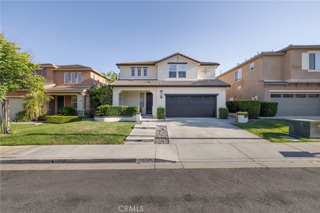 Welcome to 19924 Via Joyce Dr, a spacious and beautifully maintained 5 bedroom 3 bathroom home nestled in a desirable Santa Clarita neighborhood with no HOA or Mello Roos. Boasting approximately 2800 square feet of living space, this residence offers an ideal layout for both everyday living and entertaining.
There is a bedroom on the first floor with an adjacent full bathroom, perfect for an in law suite or guest quarters. The heart of the home is the open concept kitchen featuring a large center island, perfect for gathering with family and friends. The living room is equipped with ceiling speakers, great for hosting or enjoying movie nights.
The home also features a bar area with built in shelves that can be transformed into a cozy lounging area, ideal for entertaining. The 3 car garage has been upgraded with epoxy flooring, fresh paint, and built in cabinets and racks for storage.
The inviting primary suite includes a generous walk in closet and a spa like ensuite bath offering a peaceful retreat. Throughout the home, you will find ample storage and well sized bedrooms to accommodate a variety of needs. Step outside to enjoy the private backyard with a built in grill, perfect for outdoor dining and relaxing summer evenings. Conveniently located near top rated schools, shopping, dining, and parks, this turnkey home is ready to welcome its next owner.