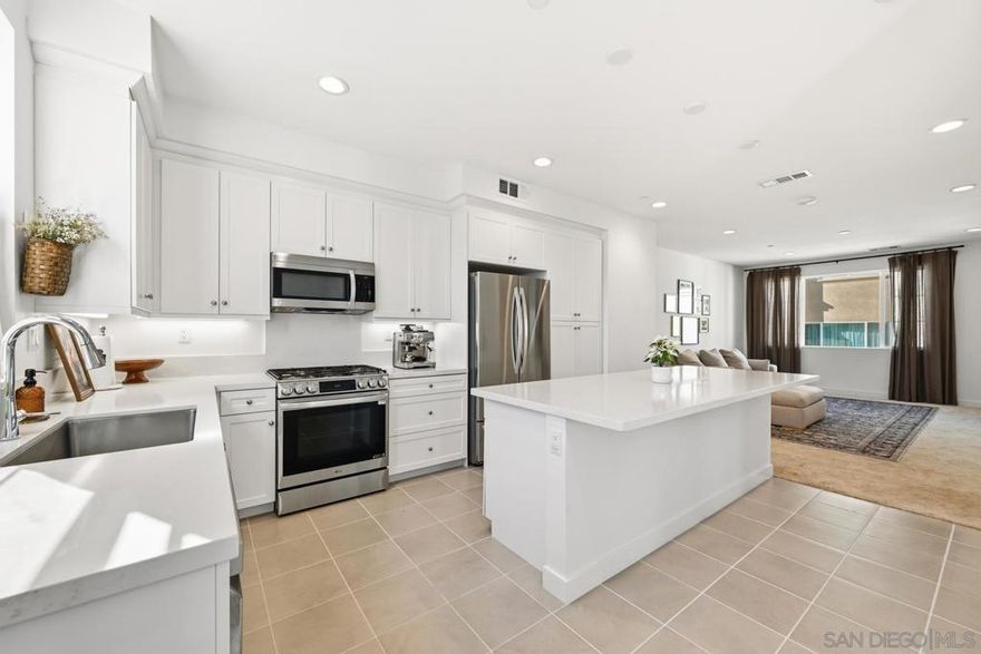 Don’t miss this virtually new home built in 2024 as part of the Boulevard Park collection in Escondido! This property is ideally situated towards the rear of the community allowing for a quieter and less trafficked location. It has no neighbors behind, backing to the neighborhood park and opening up great views and lots of natural light! This homesite is also one of only a few that have a private two car driveway which allows for expanded vehicle parking/garage use options and gives this property a single family home feel! This property includes an owned solar system to keep electricity costs low and an EV car charging station in garage among many other fantastic features! Interior layout has a bonus room on the entry level that could be office, kids play room, game room or anything else you decide. All three bedrooms are on third level along with the laundry closet for added convenience. A raised front patio area with room for a BBQ and outdoor lounge furniture round out this great opportunity. Low HOA and no Mello Roos too, request a tour today!