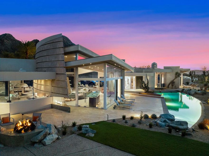nestled within the prestigious enclave of The Quarry At La Quinta, stands a Guy Dreier masterpiece on a double lot (1.1 acres) with South views of holes 16th and 11th and majestic mountains. There are no houses on view now or ever. A stunning glass bridge leads you to the front door. The main house features 4 bedrooms with attached baths, unique powder room, study/office with a half bath, gym, formal dining with pocket doors to outdoor eating area. Gourmet kitchen with large island and attached service kitchen for large parties. Detached Casita with bedroom, bath and office/art studio. The newly landscaped Backyard offers large infinity edge pool, waterfall, firepit and fireplace. BBQ area. 3 car climate-controlled garage, storage room, golf cart garage, carport. WALLS OF GLASS enhance the amazing views from every rooms. New pool & spa heaters, lights, HVACs. Must see the home to fully appreciate how special this offering At The Quarry is. The Quarry is the only TOP 100 private Golf course in the Coachella Valley. Offered Furnished per inventory.