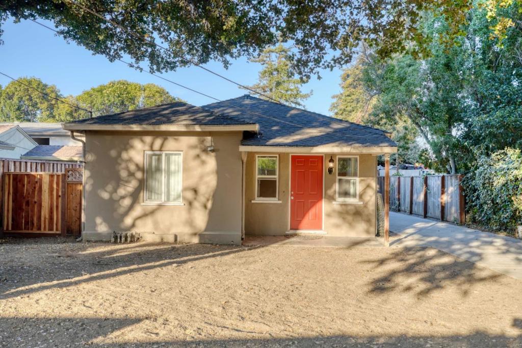 Easy to come home to! 1871 Woodland Avenue located on the west side of Hwy 101 and minutes from downtown Palo Alto. The private front yard has high fences, mature trees and shrubs, and plenty of off-street parking. Open the welcoming front door into a furniture friendly living room with warm gold flooring, then step through to the modern kitchen with an abundance of white cabinets, white appliances, gas range and window over the stainless-steel sink. Prepare simple snacks here or entertain with elaborate meals. There are two carpeted bedrooms and a light and bright bathroom. Plus, inside laundry with linen closet. Outside theres an easy-care yard and bonus shed. Situated in a desirable neighborhood, this cute home is ready to move right in. Put it at the top of your must see list.