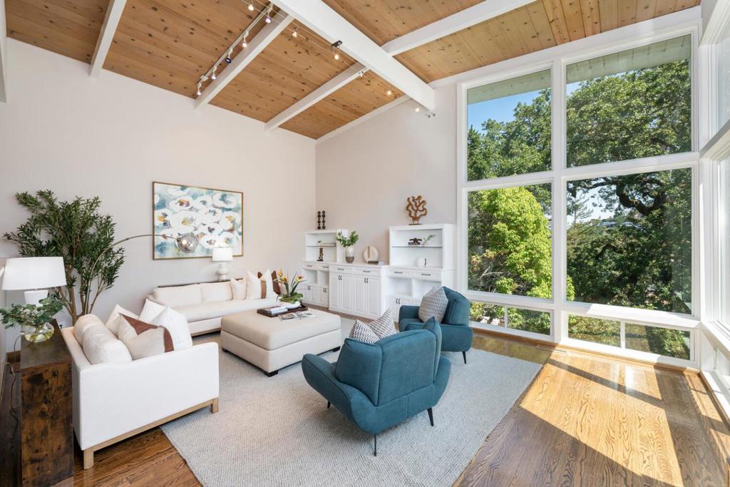 Located in the highly desirable Devonshire neighborhood of San Carlos, 81 Devonshire Circle offers the rare combination of space, style, and serenity. This expansive 5-bedroom, 4-bathroom home is nestled among mature oak trees on a peaceful street in a friendly, established community. The main level features an updated kitchen, dining area, cozy sitting room, and a spacious family room with custom built-in cabinetry and picturesque neighborhood views. Enjoy seamless indoor-outdoor living with direct access to the back and side yards, complete with decks ideal for entertaining or relaxing in a private, natural setting. The well-designed layout includes a generous primary ensuite, two additional bedrooms nearby, and a separate ensuiteperfect for guests or multigenerational living. A fifth bedroom downstairs offers flexibility as a home office, gym, or guest space. Additional highlights include central A/C, a 3-car garage, and an EV charger for modern convenience. Located in the sought-after Carlmont High School district and just minutes from vibrant downtown San Carlos, top-rated schools, parks, hiking trails, and commuter routes. This is a special opportunity to enjoy peaceful Peninsula living without sacrificing access to everyday amenities.