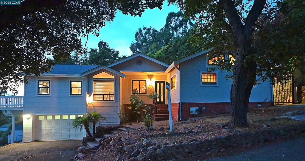 Situated on a quiet street among the trees this beautiful, custom, updated home awaits! Open and airy with amazing vaulted ceilings and a flowing floorplan, you’ll find ample living space. Main floor features include a large eat-in kitchen, dining area, office, full bath, primary bedroom suite with a large primary bathroom and a living room perfect for entertaining. Primary bedroom and living room both access a large front balcony where you can enjoy the gorgeous sunset and bay views! Lower level has an additional bedroom plus another full bathroom and laundry (ADU potential). Central heating and a/c. Most windows as well as the roof have been replaced recently. Outside features a back patio perfect for both relaxation and entertaining, as well as a large landscaped terraced yard. Circular driveway in front with ample parking further compliments the endless opportunities that abound. Just seconds from 580 this home leaves you feeling close enough to access anything in the city, but surrounded by nature and all that the Oakland Hills has to offer!