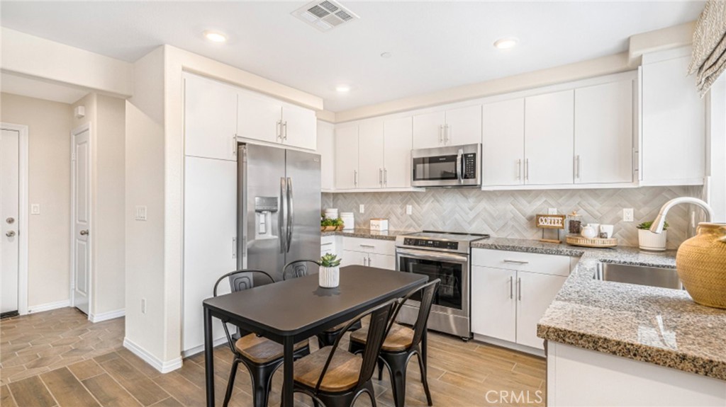 NEW CONSTRUCTION! Ready for Immediate Move-in! Includes Upgraded Flooring! The first floor of this two-story home is host to an open concept layout that seamlessly connects an inviting Great Room, dining area and modern kitchen. Upstairs are three bedrooms, including the restful owner’s suite, which is nestled in the back corner of the home for enhanced privacy and comfort. A versatile loft offers shared living on the second floor.
The Paseo is a new collection of townhomes for sale coming soon to the Highgrove Town Center master-planned community in Highgrove, CA. Residents enjoy prime amenities within the community such as a social clubhouse, sparkling swimming pool, barbecue areas, tot lot and more. For local outdoor recreation, Box Springs Mountain Reserve Park features trails for hiking, mountain biking and horseback riding. Shopping and dining options at Downtown Riverside and the Mission Inn are just a 10-minute drive, while UCR is even less and nearby K-12 schools are a three-minute drive away.