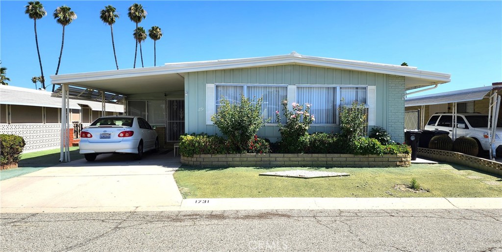 Beautiful and spacious manufactured home on its own land, located in a quiet and convenient area of Hemet. This well-maintained home features 2 bedrooms and 2 full bathrooms, a large living and dining area, plus an additional spacious dining space near the kitchen, perfect for casual meals or entertaining. You'll also enjoy a generous bonus room that can serve as a home office, game room, or even a third bedroom. For added convenience, the property includes a storage shed, a cozy side porch ideal for relaxing or enjoying family barbecues, and a covered front carport for parking and weather protection. Located in the desirable 55+ community of Sierra Dawn Estates, offering low HOA fees and access to fantastic amenities including clubhouses, swimming pools, spas, a fitness center, RV parking, and more. Conveniently situated near shopping, dining, and medical facilities.