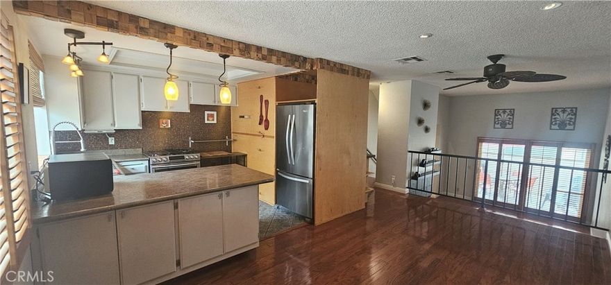 Welcome to this stunningly remodeled tri-level 2-bedroom, 2.5-bathroom townhouse located in the highly sought-after community of Santa Clarita. Blending modern style with thoughtful functionality, this beautifully updated home features rich hardwood flooring, dimmable recessed lighting, and a cozy gas fireplace—creating a warm and contemporary living space.



The kitchen is a true centerpiece, boasting a ceramic tile backsplash, granite countertops, a stylish café-style peninsula perfect for casual dining, along high-end stainless-steel appliances—including a gas range, dishwasher, and a microwave with built-in shelving.



Upstairs, both generously sized bedrooms come with private en-suite bathrooms. 



Stay comfortable year-round with a Nest smart AC panel for precise climate control.

Step outside to your private patio, complete with custom floor tile, outdoor dining furniture, and programmable lighting—ideal for relaxing or entertaining.



Additional highlights include:



Direct access to an attached 2-car garage, in-unit washer and dryer.



Access to community pool and playground.



Situated in the family-friendly Canyon Country neighborhood, you’ll be near top-rated schools such as Canyon High School, Pinetree Community Elementary, and CedarCreek Elementary—each known for academic excellence and strong community ties.



With luxurious upgrades, smart home features, and access to resort-style amenities, this move-in-ready townhouse is the perfect place to call home.



Don’t miss out—schedule your private showing today!