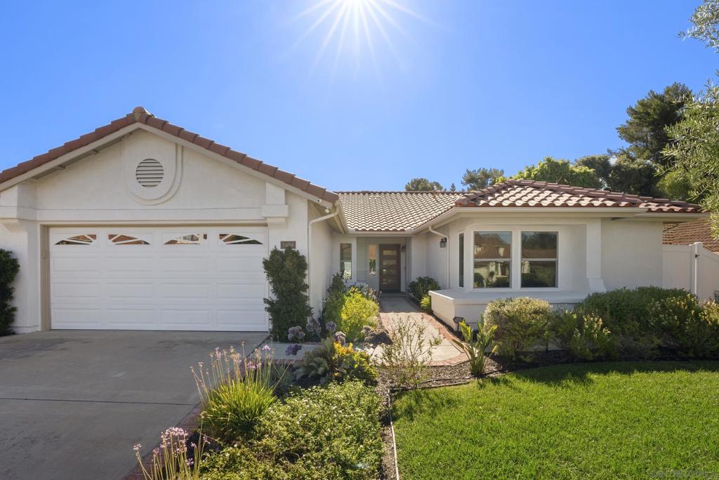 This beautifully remodeled Shadowridge home was designed with every detail intentionally chosen having comfort, quality, and long-term living in mind. Inside and out, the upgrades are timeless with modern function. Exterior improvements include new windows, roof, HVAC system, fresh paint, landscaping with smart irrigation, landscape lighting, and a striking Brazilian hardwood door with glass inlays. Step inside to find recessed smart lighting with dimmers, upgraded fixtures, and manufactured walnut hardwood flooring. Custom maple cabinetry, quartz countertops, custom blinds, and upgraded baseboards flow throughout.The chef’s kitchen is equipped with KitchenAid stainless appliances, pendant lighting, pot filler, farm sink, tiled backsplash, office nook, pullouts, under-cabinet lighting, and remote blinds. Relax by the stone gas fireplace in the living room or retreat to the primary suite featuring a second fireplace, oversized walk-in shower with sitting ledge, custom dual vanity with display lighting, under-cabinet lighting, and a walk-in closet with built-ins. The secondary bath offers a lighted mirror and deep plunge soaking tub.This home is more than upgraded—it’s reimagined to be lived in and loved for decades.