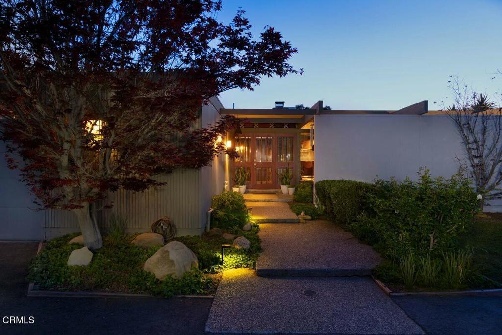 Classic Mid-Century Modern with Pool and Spa. This refined residence blends architectural clarity with natural surroundings. Floor-to-ceiling windows allow abundant light to pour in, framing mountain vistas and blurring the boundary between indoors and out. At the heart of the living room, a commanding stone fireplace serves as both a focal point and gathering space, bringing warmth and texture to the home's clean lines and open layout. Designed for relaxed entertaining and everyday enjoyment, the property's outdoor spaces include a sun-splashed swimming pool and spa, a built-in bar and barbecue area, and a hobby vineyard with Syrah, Cabernet Sauvignon, and Cabernet Franc vines. Each element supports a lifestyle rooted in both beauty and function. Inside, the architecture celebrates simplicity and scale, with open-concept living areas, seamless indoor-outdoor flow, and a layout that invites flexible use. Whether you're enjoying quiet evenings by the fire or hosting al fresco dinners with a mountain backdrop, this home offers an enduring connection to its environment, with timeless design and thoughtful details throughout.