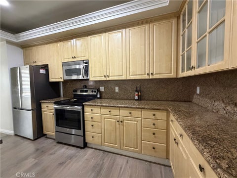 Photo of 4477 Wilshire Blvd BLVD #104, Los Angeles, CA 90010 (MLS # SB26230320)