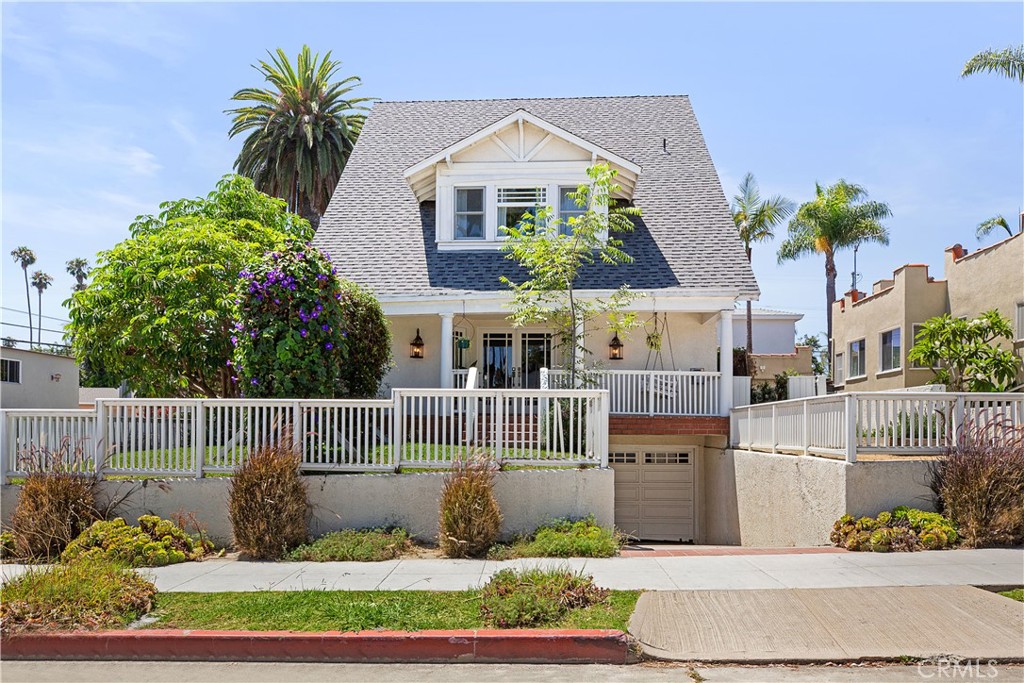 Located on an elevated lot in highly sought-after Belmont Heights, this captivating 4 bed, 2.5 bath residence is wrapped in a charming porch and surrounded by lush gardens & inviting outdoor entertaining spaces—including a private jacuzzi/spa in the backyard for ultimate relaxation. Radiating natural sunlight and exuding an effortlessly stylish vibe, the home spans 3 levels of vibrant living space. The main floor boasts a bright and cheerful eat-in kitchen with upgraded countertops, stainless steel appliances, and a fireplace, seamlessly connected to a stunning dining room highlighted by elegant built-ins, picture molding, & Art Deco-inspired hardwood floors. These rich details continue into the warm and inviting living room, complete with a delightful sitting area with an incredible Batchelder tile fireplace.Upstairs, 3 bedrooms and a beautifully appointed full bath await—one bedroom featuring a versatile sunroom ideal as a reading nook, office, or creative space. The entire 3rd level is a dreamy primary retreat with dual closets & lovely peek-a-boo ocean views.The whole property feels so private yet offers wide open vistas to the mountains and beyond because of its unique orientation & premier location. Walking distance to award winning schools, trendy shopping & dining in Belmont Shore, Alamitos Bay & the Beach.