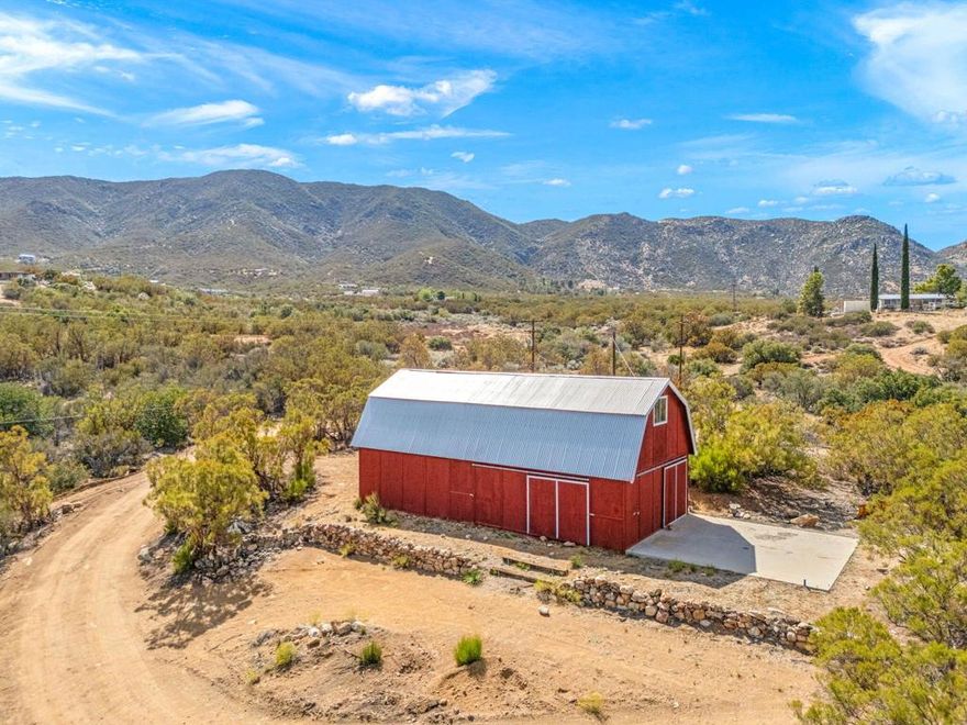 Bring your vision to life on nearly 10 acres in serene Anza. This build-ready property offers true utility and flexibility: a barn served by 200-amp power with dedicated 30-amp and 50-amp RV outlets, a private well, ample RV parking, and a flat, graded homesite to position your future residence. A cut-in driveway is already in place, streamlining access for contractors and equipment.