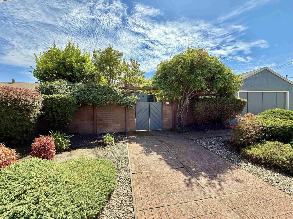 This delightful 3-bedroom, 1-bath home is move-in ready and full of character. The updated kitchen features brand-new countertops, flooring, light fixtures, and appliances—including a wine refrigerator—making it perfect for everyday living and entertaining. The bathroom has also been refreshed with new flooring, a stylish vanity, modern light fixtures, and a new mirror. Both the interior and exterior have been recently painted, and all Section 1 work has been completed, giving you peace of mind. The home offers a bonus family room, created from a garage conversion done many years ago, providing extra space for relaxing or entertaining. Enjoy the charming front courtyard and the private backyard, complete with mature foliage, creating a peaceful retreat. This home is the perfect blend of comfort, style, and convenience—ready to welcome its new owners!