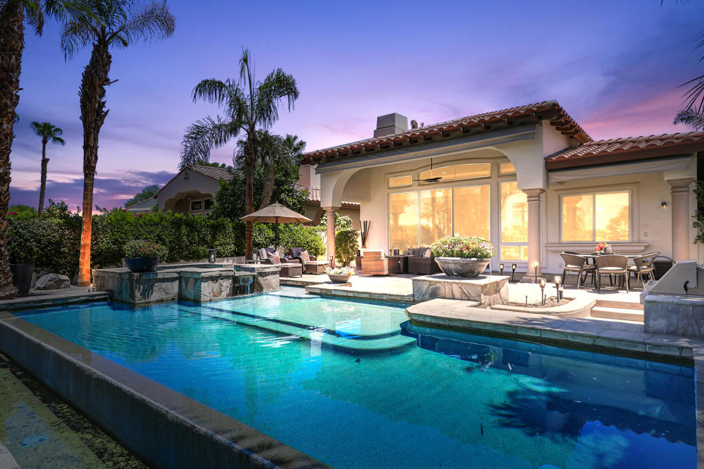 Experience the ultimate desert getaway in a beautifully appointed home that offers both comfort and spectacular scenery. Take in breathtaking panoramic views of the Santa Rosa Mountains and lush golf course from nearly every room. Relax by the stunning custom infinity pool, raised spa, and cascading waterfalls while soaking in the serene desert landscape.Designed for seamless indoor-outdoor living, the spacious step-down BBQ area is perfect for entertaining as guests swim and unwind. The poolside setting offers a tranquil space to relax, dine, or enjoy spectacular sunsets. Inside, tasteful and comfortable finishes create a welcoming retreat ideal for seasonal stays, with an open-concept layout that maximizes natural light and views. Three bedrooms plus an office provide ample space for family and friends.Guests can also enjoy access to Rancho La Quinta Clubs Olympic-sized pool, world class tennis courts, pickleball courts, and limited golf privileges up to six times per calendar year. Come to the Desert and make this your perfect vacation home.