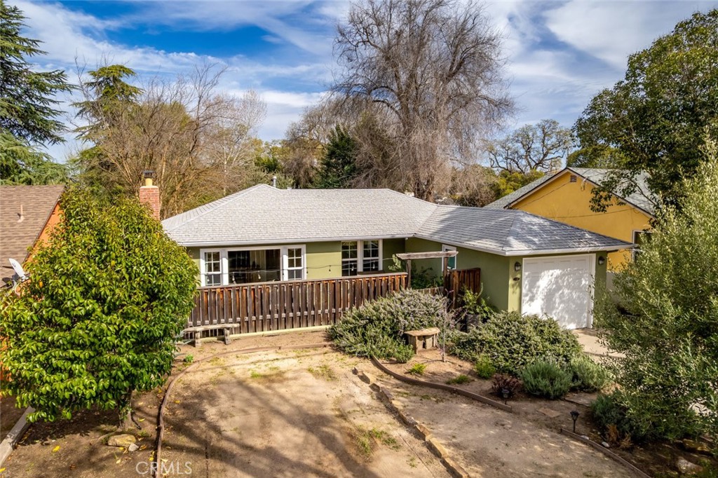 Charming West Side Paso Robles 2 bed, 1 bath, 960 sf home on a spacious 7,500 sf lot! This well-maintained property offers both indoor and outdoor living, starting with a beautifully landscaped front yard and a fully fenced front patio, ideal for relaxing or entertaining. Inside, natural light fills the cozy living room, which features a fireplace and a large window overlooking the front patio. The dining area flows into the kitchen, where you can enjoy a picturesque view of the beautifully designed backyard right from the sink! Both bedrooms are generously sized, with newer vinyl flooring and new double-pane windows throughout. Additional features include a Nest thermostat, a hard-wired ADT security system, automated smart locks on the front and back doors, a dedicated laundry room, and a single-car garage for extra storage. A newly added RV pad with an electrical hookup provides even more convenience. The gorgeous backyard is perfect for entertaining, featuring lush landscaping, a full irrigation system, stamped concrete, a covered patio, and a storage shed. Located just minutes from downtown Paso Robles, this adorable home is ready to be enjoyed and should not be missed! Information not verified.