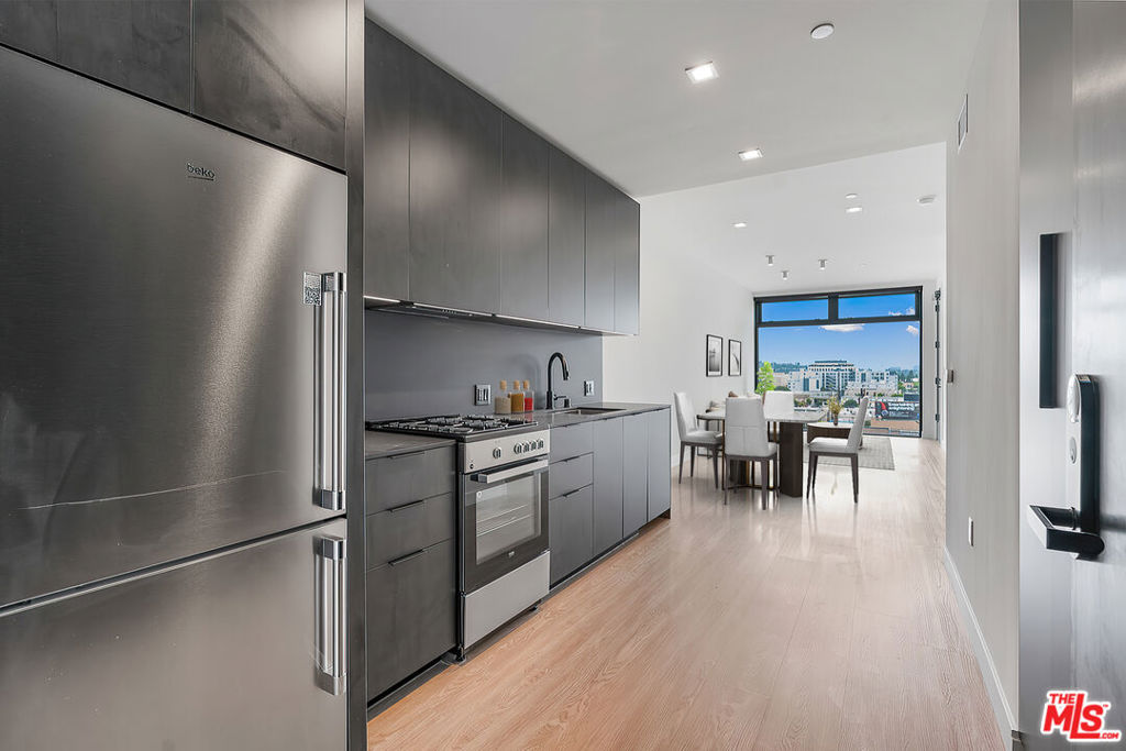 Venue Residences by Helio. 423 is a beautiful 1 bed + 1 bath is available on the 4th floor with Southern views. Kitchen has unique dark finishes with stained granite counters, matte black fixtures, and stainless steel Beko appliances. The open living and dining concept allow for a good flow of the space, as well as access to a large balcony for comfortable outdoor lounging. The bedroom has dual access to the balcony, built in lighting and a ceiling fan. In the bathroom is a wall-to-wall mirror, shower/tub, and under cabinet storage. Residence includes walk-in closet, electronic window shades and Nest thermostat. Property amenities include 2 rooftops, heated dipping pool, fitness center with Technogym equipment, co-working lounges, and front desk staff. Parking is $150/month for a single parking space, and internet $84/month. Contact us today!