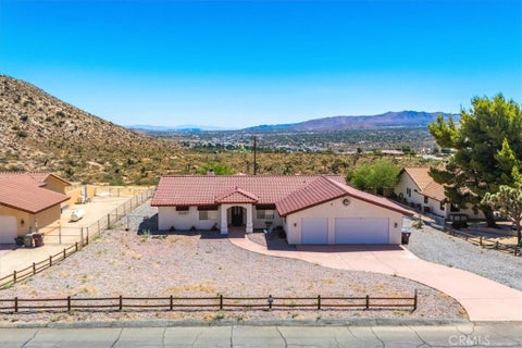 Photo of 7495 Canyon Drive, Yucca Valley, CA 92284 (MLS # JT24175742)