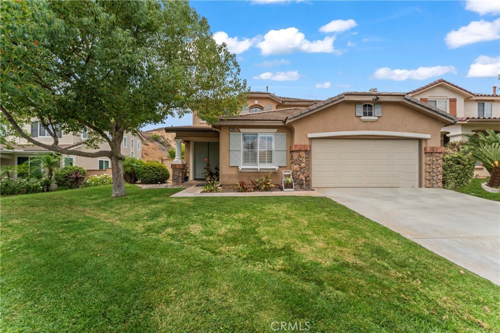 Welcome to this beautiful 4+3 view home offering an open and bright floorplan with soaring ceilings and an inviting flow throughout. Perfectly designed for both comfort and entertaining, this residence combines style, function, and an impressive view. The expansive kitchen features a stainless steel gas range, microwave and refridgerator, granite countertops, a cozy breakfast nook, and over looks the spacious family room with a warm fireplace—an ideal space for gatherings. Downstairs, there is a full bathroom, bedroom and den, perfect for guests or a private home office. Upstairs, retreat to the spacious primary suite, complete with an expansive balcony, luxurious bathroom, and a spectacular sunset view. Two additional bedrooms provide plenty of space for family or guests. Outside you will find a gas fire pit, covered patio with a built in BBQ, two mini fridges, an outdoor TV and ample bar space for entertaining. Additional highlights include: Beautiful wood and tile flooring, white shutters, ceiling fans throughout and abundant storage space. Located in a wonderful neighborhood, this home is truly move-in ready and waiting for its new owners. Don’t miss the opportunity to make this dream home yours—contact us today before it’s sold!