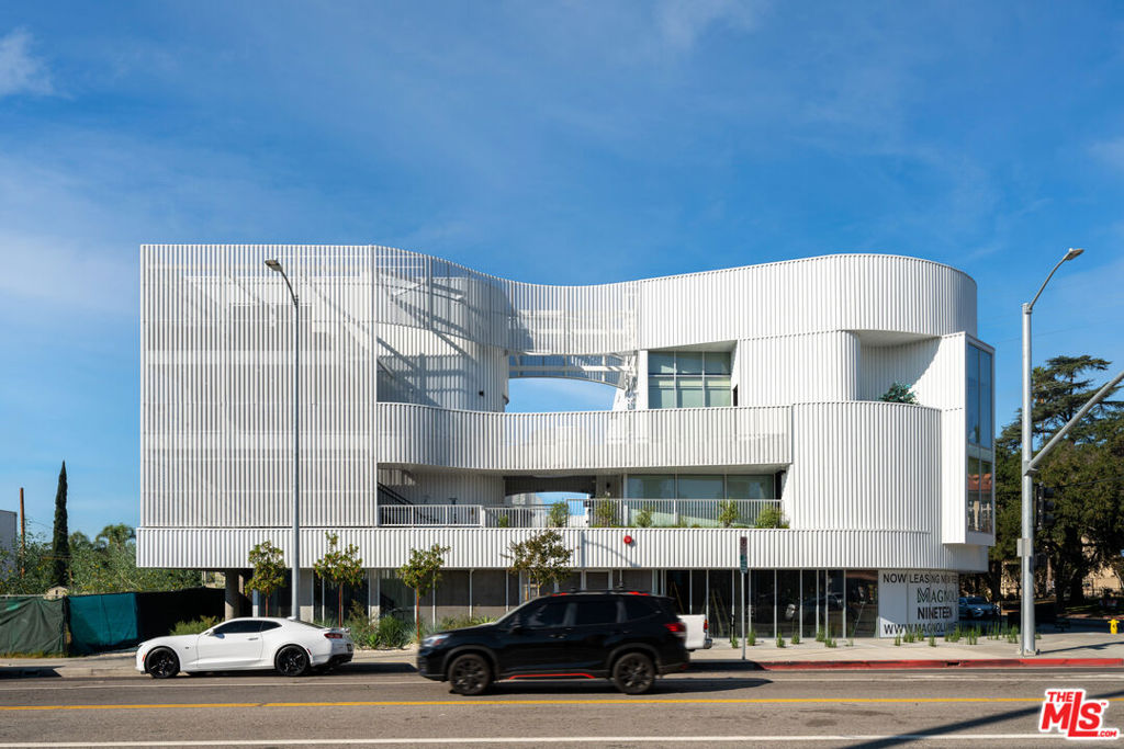 A newly constructed apartment building with 19 large lofts (ranging from 833-1,287 SF) and 1,573 SF of occupied retail space in the desirable Valley Village neighborhood of the San Fernando Valley of Los Angeles, CA. The exquisitely designed luxury homes feature a mix of lofts and 2-story lofts with high ceilings, large floor to ceiling windows, and luxury appointments that match the demand preferences of the most discerning renter. In the common areas, the Property features a plethora of outdoor courtyard and meeting spaces that include unique touches such as fireplaces, rooftop deck with barbecue, al fresco dining space, and upper sun deck. Magnolia Nineteen's unique location, at the intersection of Magnolia Boulevard and Colfax Avenue, offers a residential vibe akin to single family homes in Valley Village, Studio City (0.75 miles south), and Toluca Lake (1.5 miles southeast), while being within a mile of the heart of the NoHo Arts District and its thousands of jobs and popular entertainment, nightlife, and dining along Lankershim Boulevard. In conjunction with easy access to the 170, 101, 134, and 5 freeways, residents can access 2.7 million jobs within a 30-minute commute.