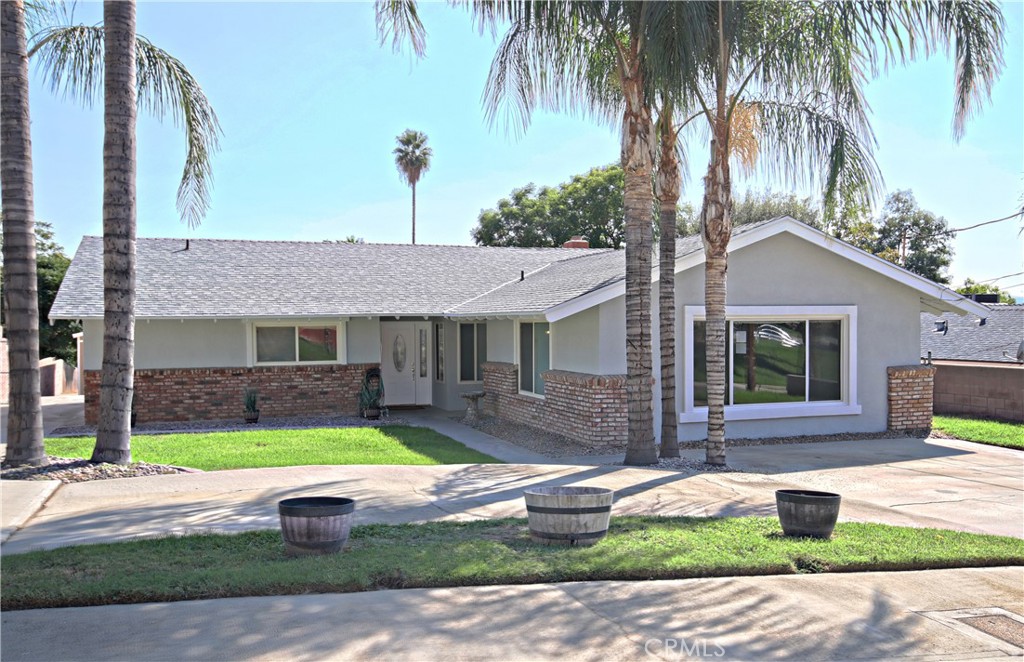 Beautifully updated single story home on a large lot and quiet street! This home is completely redone with new kitchen, baths, LVP flooring throughout and interior and exterior paint. It is move-in ready and has so much potential for a variety of uses. There is a large bonus room that could either be a family room, converted to a second master suite, or even an ADU. The master bedroom features an ensuite bathroom and a walk in closet. There is a garage-sized shed with so much storage and a built in workbench ideal for projects. Additionally, there is a second shed that could be used as a home office or craft room - it is finished on the interior and has electrical and A/C. This large 18,000 SF lot has so much potential from ADUs to work shops - check with the city. There are two driveways on the property providing plenty of parking. This home is conveniently located - 5-minute drive to Cal State San Bernardino, and only 30 minutes to Lake Arrowhead!