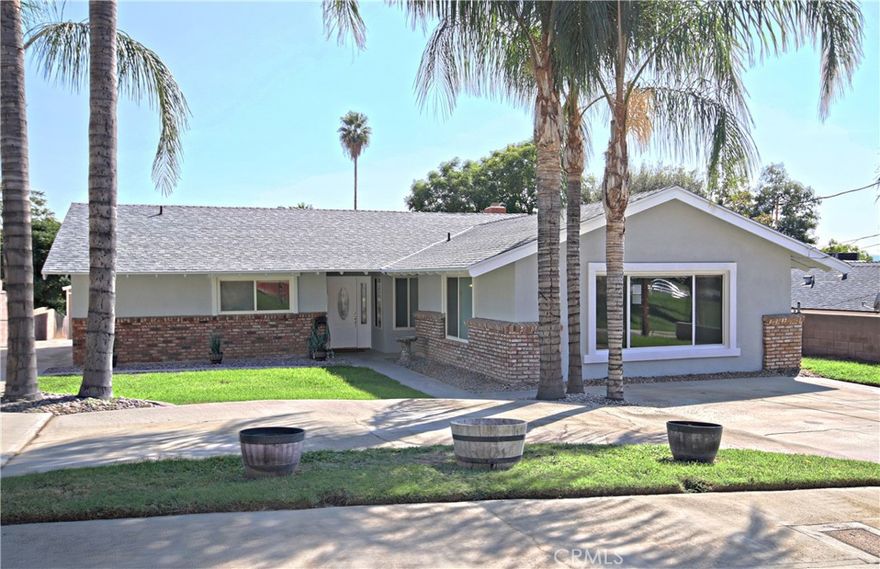 Beautifully updated single story home on a large lot and quiet street!  This home is completely redone with new kitchen, baths, LVP flooring throughout and interior and exterior paint.  It is move-in ready and has so much potential for a variety of uses.  There is a large bonus room that could either be a family room, converted to a second master suite, or even an ADU.  The master bedroom features an ensuite bathroom and a walk in closet.  There is a garage-sized shed with so much storage and a built in workbench ideal for projects.  Additionally, there is a second shed that could be used as a home office or craft room - it is finished on the interior and has electrical and A/C.  This large 18,000 SF lot has so much potential from ADUs to work shops - check with the city. There are two driveways on the property providing plenty of parking.  This home is conveniently located - 5-minute drive to Cal State San Bernardino, and only 30 minutes to Lake Arrowhead!