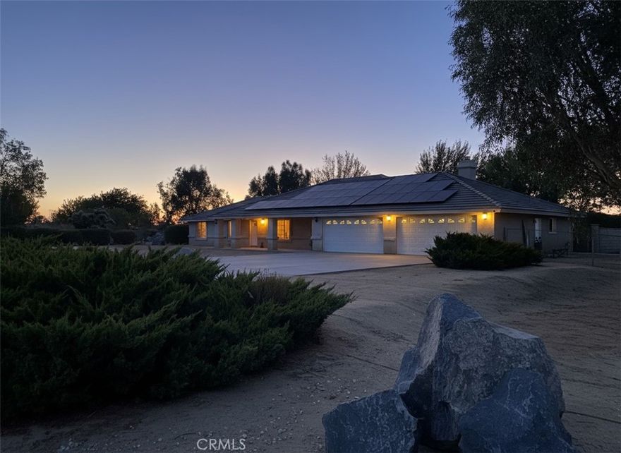 Discover this stunning and spacious 2,766-square-foot ranch-style home, offering 4 bedrooms and 3 bathrooms. Situated on a generous 2.27-acre lot, this property seamlessly combines comfort, functionality, and versatility. The residence includes a massive 4 car garage plus an additional workshop space that is ideal for hobbies or extra storage. A durable block wall divides the yard into two wonderful areas: a private, inviting family yard and a dedicated work or toy zone, perfect for livestock or horses.



The front yard features a convenient dog run, providing a safe space for your furry friends. Enjoy breathtaking views of mountain ranges and neighboring ranches from the comfort of your home.



The modern kitchen is equipped with a touchscreen refrigerator and all updated appliances, making daily living effortless. Peace of mind is guaranteed with a comprehensive water filtration and softener system, ensuring high-quality water throughout the home.



The luxurious master suite offers its own fireplace, a spacious walk-in closet, and a lavish bathroom with a freestanding tub creating a perfect retreat. 



With its abundant features and endless potential, this home truly is a must-see!