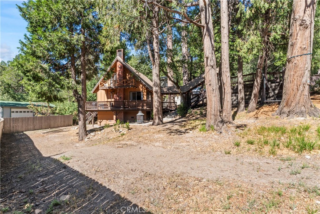 Charming Bavarian-Style Mountain Retreat. Welcome to this enchanting Bavarian-style home nestled in the serene area of Lake Arrowhead. Situated on a mostly level lot surrounded by majestic pine trees, and partially fenced. This 3-bedroom, 2-bathroom retreat offers the perfect blend of rustic charm and modern comfort.
The home features beautiful natural tongue-and-groove pine throughout, adding warmth and authentic mountain character. Recent upgrades include a new roof, updated electrical panel - generator ready, mini-split air conditioning system and duct-work, lighting and a stylishly renovated bathroom. This is
home also offers a wrap-around deck and covered entrance. Enjoy the convenience of easy year-round access and a prime location just minutes from Lake Arrowhead Village, SkyPark at Santa’s Village, and numerous hiking trails. Whether you're looking for a full-time residence or a weekend getaway, this inviting mountain retreat in Crest Park area, delivers comfort, style, and the best of mountain living.
