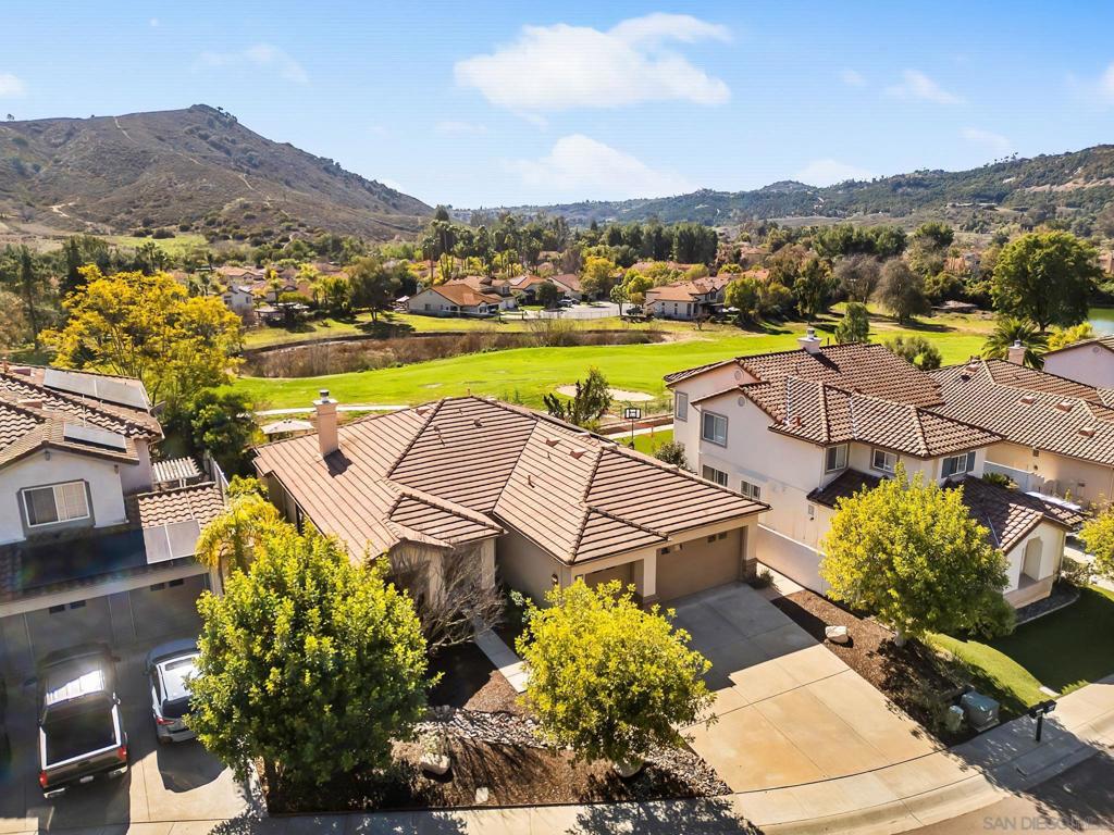 Upgraded Single-Level Home in Gated Rancho San Pasqual! Nestled between majestic mountains and stunning golf course views, this 3-bed, 2.5-bath, 2,404 sq. ft. home offers modern upgrades and an open, airy floor plan. You’re welcomed by soaring vaulted ceilings, luxury vinyl plank flooring, and abundant natural light. The chef’s kitchen boasts stainless steel appliances, a Sub-Zero refrigerator, a walk-in pantry, and a marble backsplash, seamlessly flowing into the family room and breakfast nook. The spacious primary suite includes a retreat (optional office), an upgraded bath with Travertine floors, and a walk-in closet. Recent upgrades include a new HVAC system (2024), LVP flooring (2019), a kitchen facelift with new countertops, painted cabinets, and brass hardware (2019), and drought-tolerant landscaping (2022). Additional features include owned solar, a whole-house water filtration system, a new water heater, California shutters, and fresh interior/exterior paint. A highly efficient dual fuel heating system and a large owned solar system mean very low energy bills. An attached 3-car garage provides ample storage. Located in a highly desirable gated community, this home offers the perfect blend of luxury, comfort, and energy efficiency.
