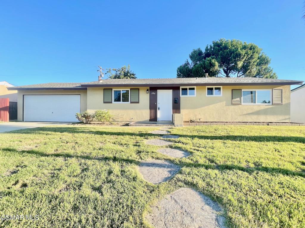 Welcome to 1596 Casarin Ave, a charming 3-bedroom, 1.5-bathroom home nestled on a lovely street in Simi Valley. This move-in ready home features fresh interior paint and exterior trim paint, brand-new windows, sliding glass door, and stylish vinyl flooring throughout. The kitchen offers direct access to the garage where you will find your laundry area and convenient way to unload your groceries. Step outside to enjoy beautifully manicured front and back lawns, a mature shade tree, and a fruit-bearing Burgundy plum tree. The backyard is fully enclosed with a block wall for privacy and includes a large covered patio--perfect for entertaining, outdoor dining, or relaxing evenings. With its prime location, fresh updates, and welcoming curb appeal, this home is ready for its next chapter. The yard is large enough for a guest house (ADU) and a pool!