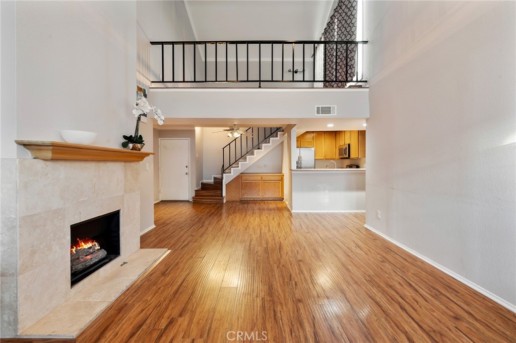 Bright and spacious top-floor 2 bed, 2 full bath townhome with soaring ceilings, loft, and in-unit laundry. The open living room offers a cozy fireplace, abundant natural light, and a private balcony overlooking the courtyard. Updated kitchen features granite counters, stainless steel appliances, and generous cabinet space. Upstairs loft opens to a private rooftop deck, perfect for relaxing or entertaining. Additional highlights include dual-zone A/C, two assigned parking spaces, and a secure community with pool, fitness center, game room, and BBQ area. Ideally located near Ventura Blvd’s shops, dining, and easy access to the 101 and 405.