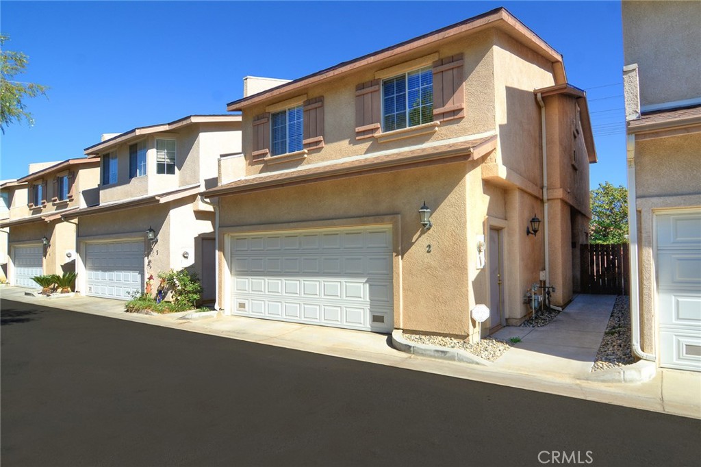 This is the one you’ve been waiting for! Built in 2002 and recently remodeled for it’s new tenants, including updated wood floors, fresh paint, window treatments, ceiling fans in all 3 bedrooms, Quartz counters in the kitchen, stainless appliances & so much more. Free standing home (NO SHARED WALLS) in a 9 unit community with a 2 car garage offering direct access inside. Light and bright with a great layout; all 3 bedrooms and 2 bathrooms upstairs but with a conveniently located half bath on the first floor. Large and open living space featuring a formal dining room off the kitchen with open views to the living room. Living room offers high ceilings, fireplace and a sliding door granting access to your private rear yard. Masterfully remodeled kitchen showcasing upgraded QUARTZ counters, stainless sink w/pull down faucet, stainless appliances & loads of cabinet space. The master suite is a restful retreat where can enjoy a HUGE walk-in closet, vaulted ceilings, loads of natural light, brand new ceiling fan and generous sized en-suite bath featuring double vanity sinks. All this located less than a block from Woodland Hills and Westfiled's Topanga Mall, "The Village" & Westfield's newest upcoming project, "LA Warner Center."
