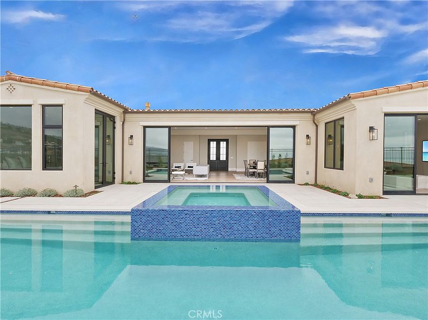 Completed in March 2021, this ONE-LEVEL Santa Barbara-inspired home offers stunning views of the ocean, coastline, and golf course. An immediate connection to the views and outdoors is felt as you enter this spacious, open-concept home through custom iron double doors, it is perfect for entertaining with a large group. The great room, kitchen, and family room flow seamlessly together, opening outdoors through custom paneled glass doors for unparalleled indoor-outdoor living. The backyard features a fantastic pool, an infinity spa, and a sunken fire-pit seating area. The great room showcases a modern linear fireplace with a custom surround. The master suite offers ocean views and directly accesses the spa, along with a large custom closet providing ample island storage. The bathroom includes a flush-entry shower, dual vanities, and a free-standing tub. Throughout the entire home, Weather Shield windows enhance comfort. All bedrooms feature custom cabinets and closets, along with a separate French door entry. This home features a thoughtfully designed floor plan built with quality and style. You will love the breathtaking sunset ocean views, the excellent climate in this section of the peninsula, top-rated schools, and the home’s high ceilings and open feel—all on one level. This is a forever home! Plus, it offers easy walking access to a network of ocean hiking trails in a great neighborhood with 24-hour security patrols. Too many features to list. Don’t miss this fantastic opportunity!