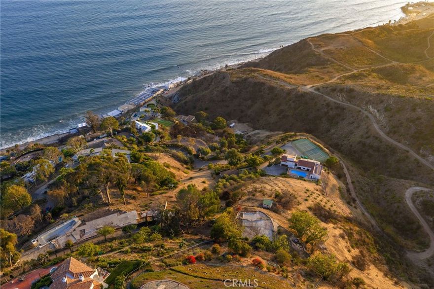 ONCE-IN-A-LIFETIME OPPORTUNITY IN MALIBU – 2.33 ACRES WITH SPECTACULAR OCEAN & MOUNTAIN VIEWS.



Rarely does a property of this caliber come to market. Nestled at the end of a private cul-de-sac, this 2.33-acre parcel offers unmatched privacy, sweeping coastline and mountain views, and the perfect setting to design your dream home. With only two owners in its history, the property is both unique and irreplaceable. Located just minutes from the Pacific Coast Highway, Malibu’s world-class beaches, shopping, and dining, yet tucked away in a tranquil setting close to hiking trails, it combines seclusion with convenience. Whether you envision a private coastal retreat or a bold architectural statement, this once-in-a-lifetime opportunity provides the rare chance to create a legacy estate in one of Malibu’s most sought-after locations.