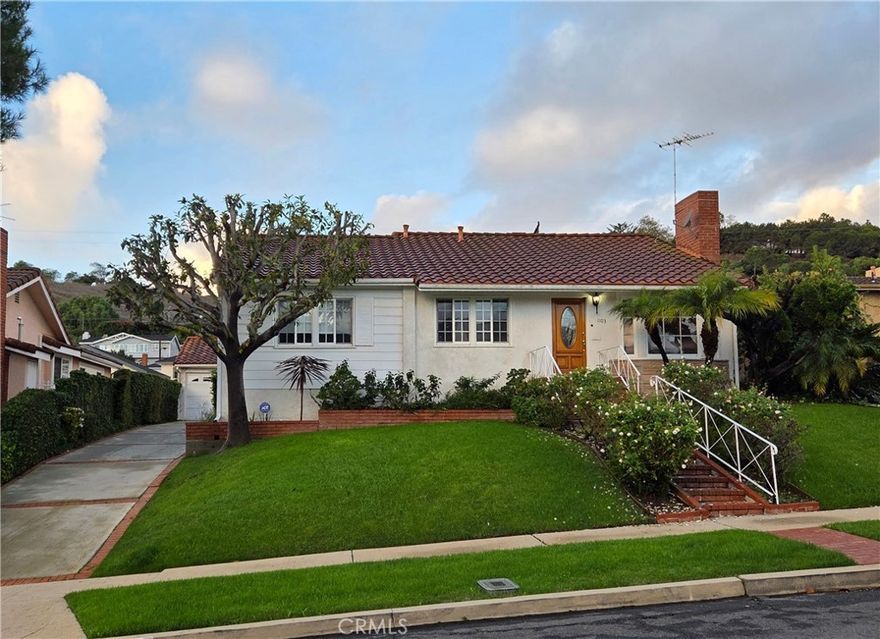 Fantastic opportunity to purchase this home lovingly held by the same family and offered for the first time in almost 60 years.  A wonderful, bright property which sits high on the lot, located on one of the best streets in the prime upper Vista Del Oro neighborhood of San Pedro.  This home can be your haven which has the square footage necessary to make it your own with a large living room and dining area, eating area within the kitchen with counter seating which looks into the substantial sized family room with brick fireplace and hearth. Turn on the fireplace while cooking or enjoying activities in the family room. Open the sliding door to enjoy the lush, private backyard. The living space boasts three bedrooms with a spacious master and two other nicely sized bedrooms to enjoy.  There is a full bath off the hallway along with a 3/4 bathroom off the master bedroom. It also has a separate laundry room with it's own porch access. There is a detached two car garage with additional parking on the upper driveway. If you are looking for a one level home, this is it.  From the driveway or garage, you are just a few steps away to enter the home from the back patio area if you don't wish to walk up the lovely rose laden front stairway.  Such a special home for the next family to build their own memories.  Amazing Averill Park is close by, along with the local elementary school, shops at the Weymouth Center and easy freeway access.