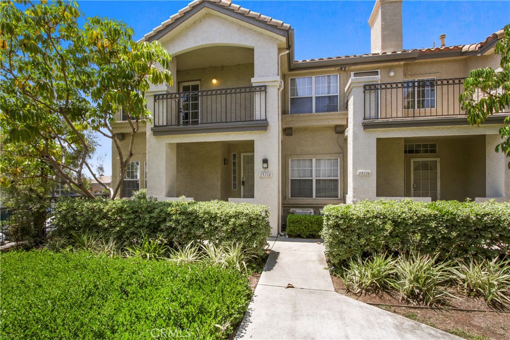 ORIGINAL OWNER; FIRST TIME ON THE MARKET! This meticulously maintained townhome in the gated "La Mirada Town Center Townhomes" community showcases pride of ownership. Ideally located within the complex, this end-unit, attached on one side with no neighbors above or below, offers privacy and comfort.
This tri-level home features three spacious bedrooms and 2.5 bathrooms. The inviting front porch adds charm, leading to an open-concept interior with abundant natural sunlight streaming through south-facing windows, creating a bright and airy atmosphere. The living room boasts a tile fireplace, flowing seamlessly into the kitchen with bar seating and dining area. A convenient half bathroom and inside laundry are located downstairs.
The elegant primary suite includes dual sinks, a large walk-in closet, and a French door opening to a cozy balcony with a peaceful view, perfect for relaxation. Additional highlights include direct access to an oversized two-car garage, plus guest parking within the complex and on-street parking. Residents enjoy access to the association pool and spa.
Situated near shopping, restaurants, grocery stores, a post office, movie theater, transportation, and golf courses, this home offers unmatched convenience. Move-in ready with exceptional attention to detail, this is a rare opportunity to own a delightful property in a prime location.