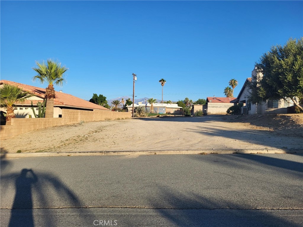 Discover the perfect opportunity to build your dream home on this .18 ac lot situated adjacent to 12775 Hidalgo St, this parcel offers a blend of privacy and community in a quiet residential setting. The lot is level and easily accessible, surrounded by well- maintained single-family homes, and provides ample space for a custom residence with a yard, garden, or pool. It's position captures the dramatic backdrop of the San Jacinto and San Bernardino Mountains, making it ideal for those who appreciate natural desert beauty and stunning views. Conveniently located near local shops,schools, and minutes from Palm Springs, this lot is perfectly suited for year-round living, a vacation getaway, or a long-term investment property. With utilities nearby and homes already established on the street, development is straightforward and supported by an existing community.