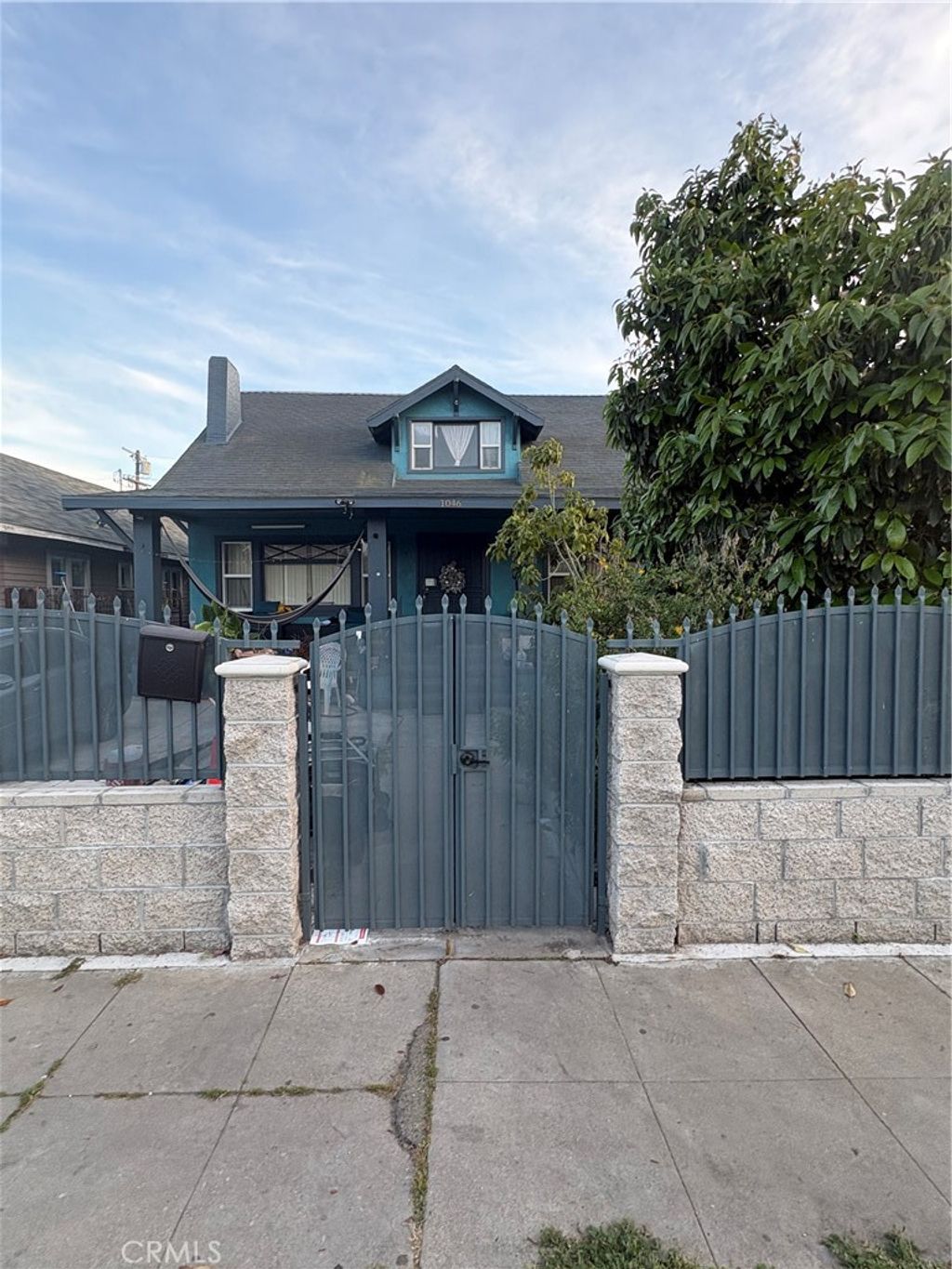 Photo of 1046 W 49th St, Los Angeles, CA 90037 (MLS # CV26071048)